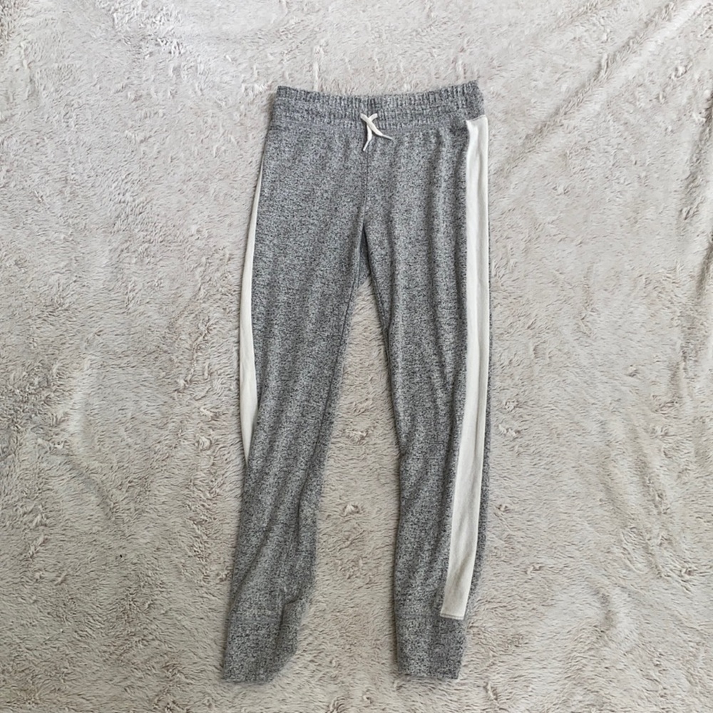 grey joggers with white strip down the side